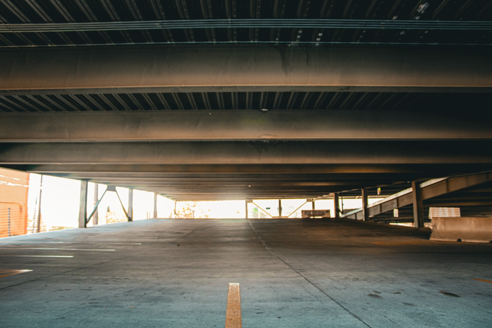 Covered parking spaces beneath the garage deck