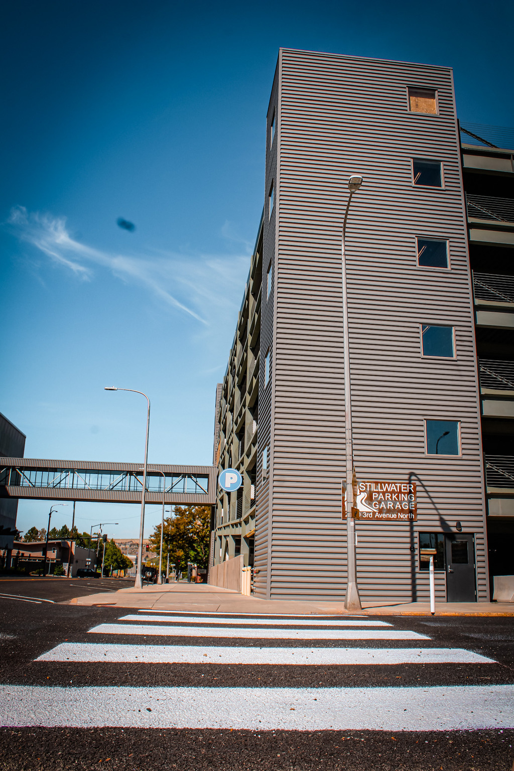 Stillwater Parking Garage viewed from the crosswalk, with the skybridge on the left